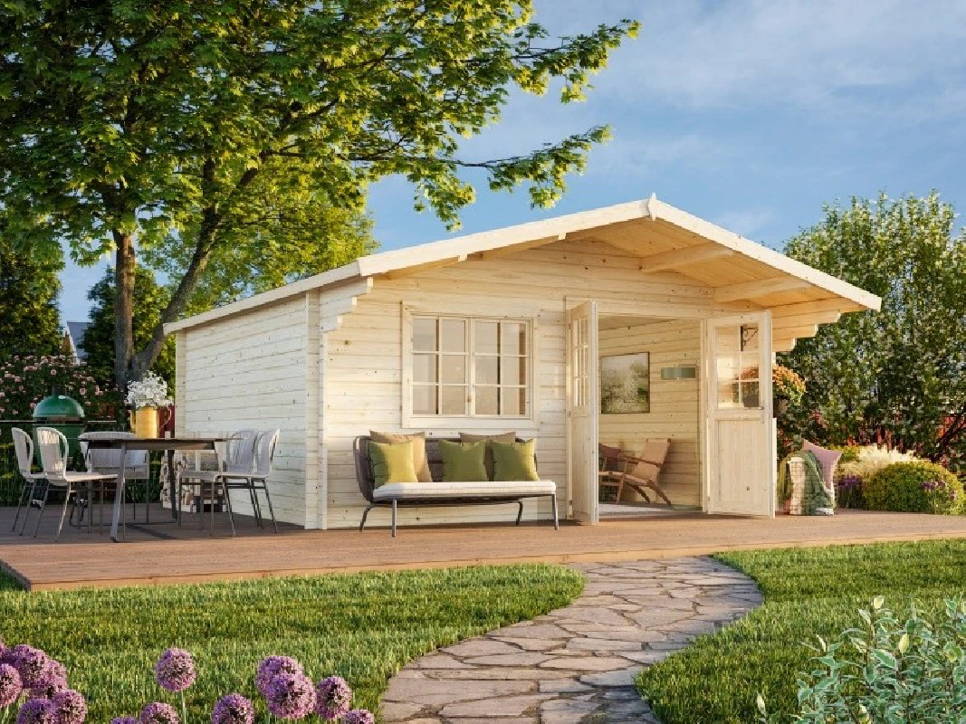 Abri Britta 19,7 m² avec terrasse meublée et allée en pierre dans un jardin